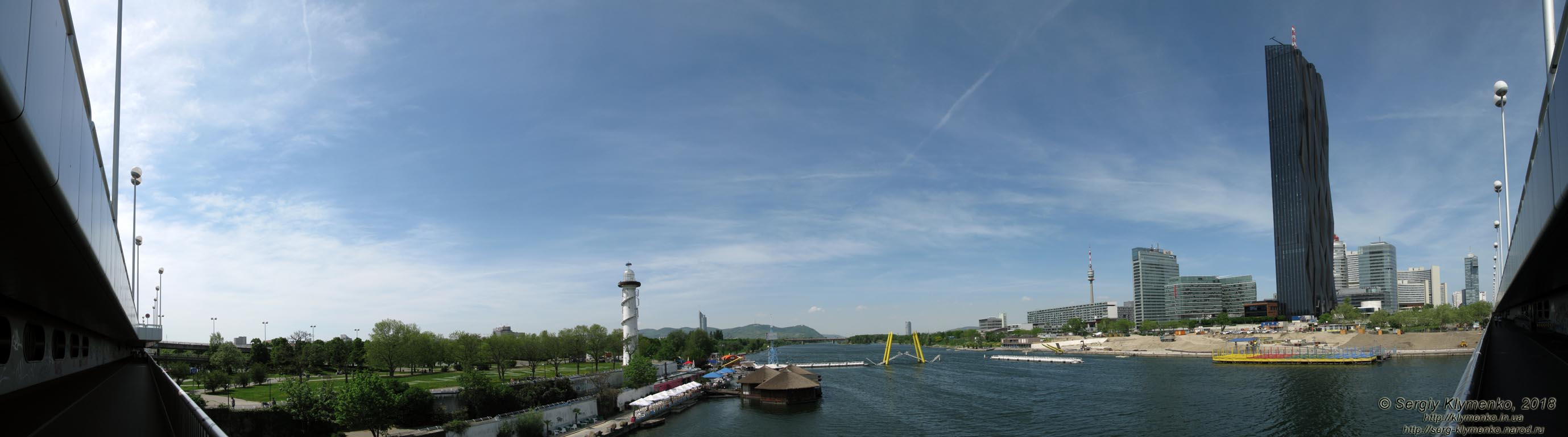 Вена (Vienna), Австрия (Austria). Фото. Вид от станции метро «Donauinsel»: рукав Новый Дунай (Neue Donau),
слева - остров «Donauinsel», справа - застройка «Donau City» и «UNO-City». Панорама ~180°.