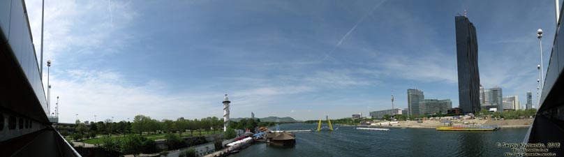 Вена (Vienna), Австрия (Austria). Фото. Вид от станции метро «Donauinsel»: рукав Новый Дунай (Neue Donau),
слева - остров «Donauinsel», справа - застройка «Donau City» и «UNO-City». Панорама ~180°.